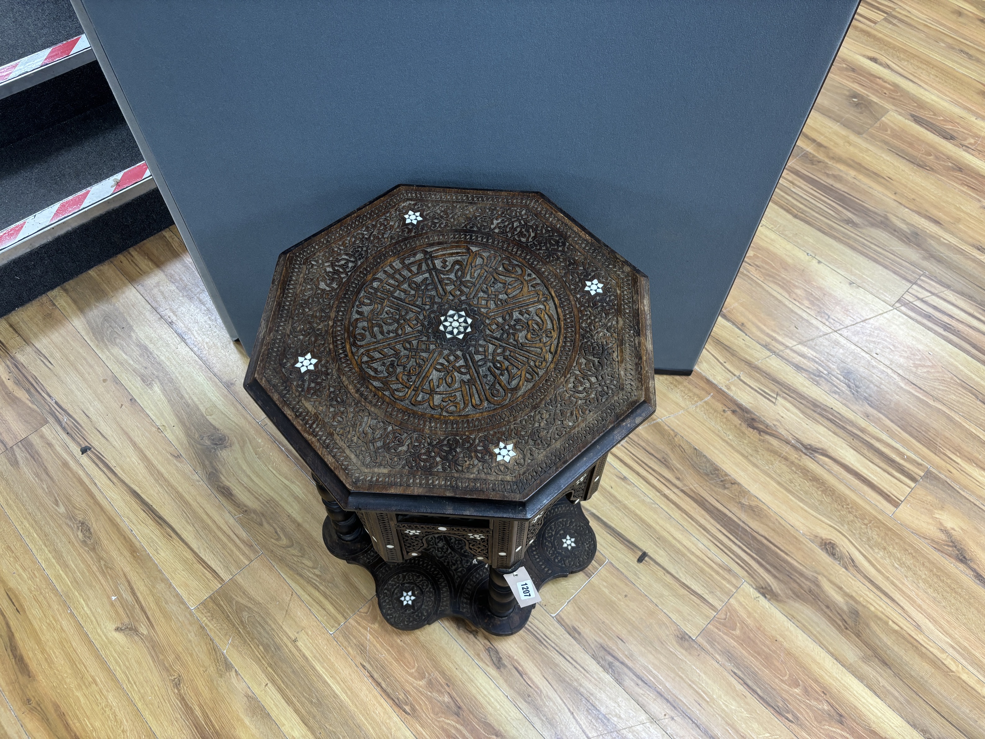 A Moroccan octagonal bone inlaid hardwood table, width 52cm, height 64cm